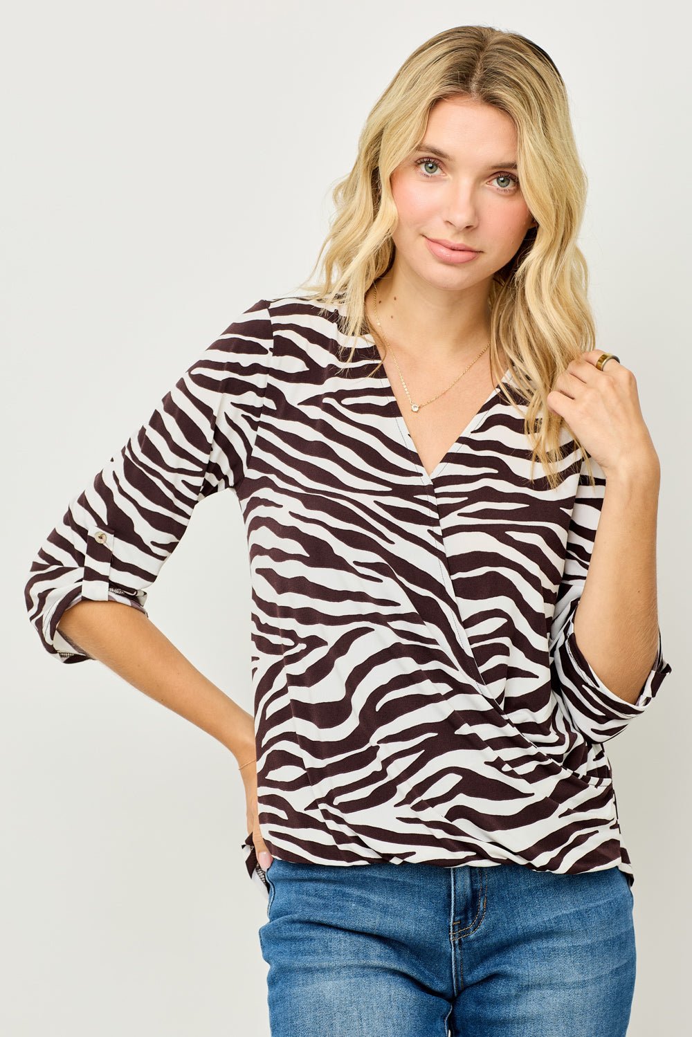Image of West K Alexa Knit Surplice Roll Tab Blouse White Brown Zebra