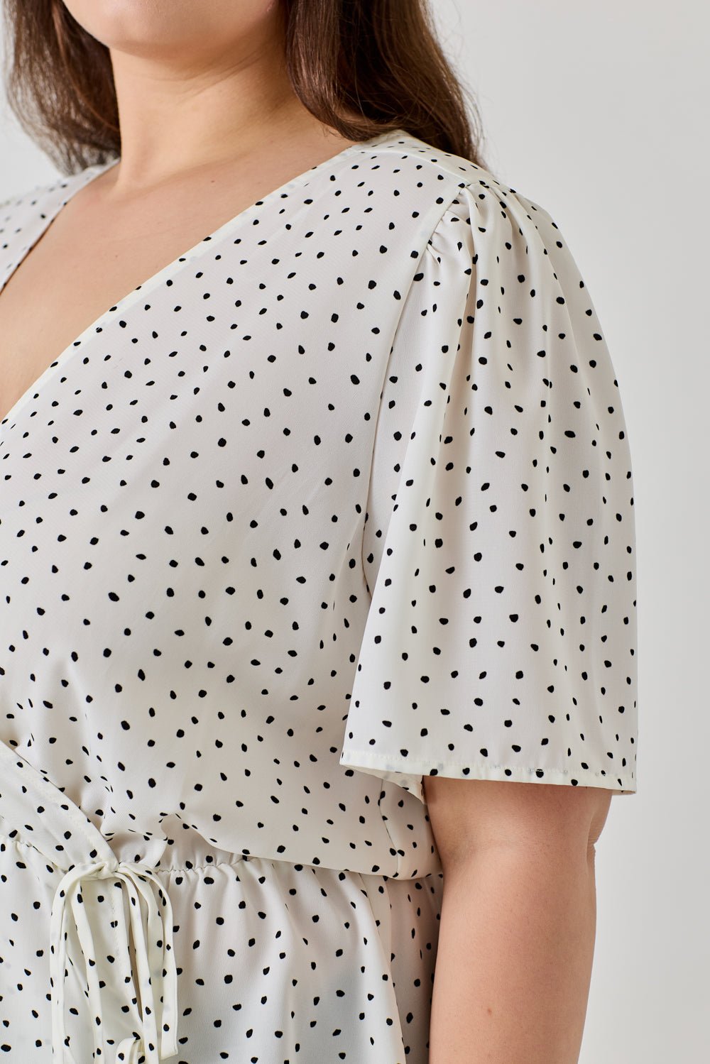Image of West K Casey Plus Size Surplice Peplum Top Ivory Dot