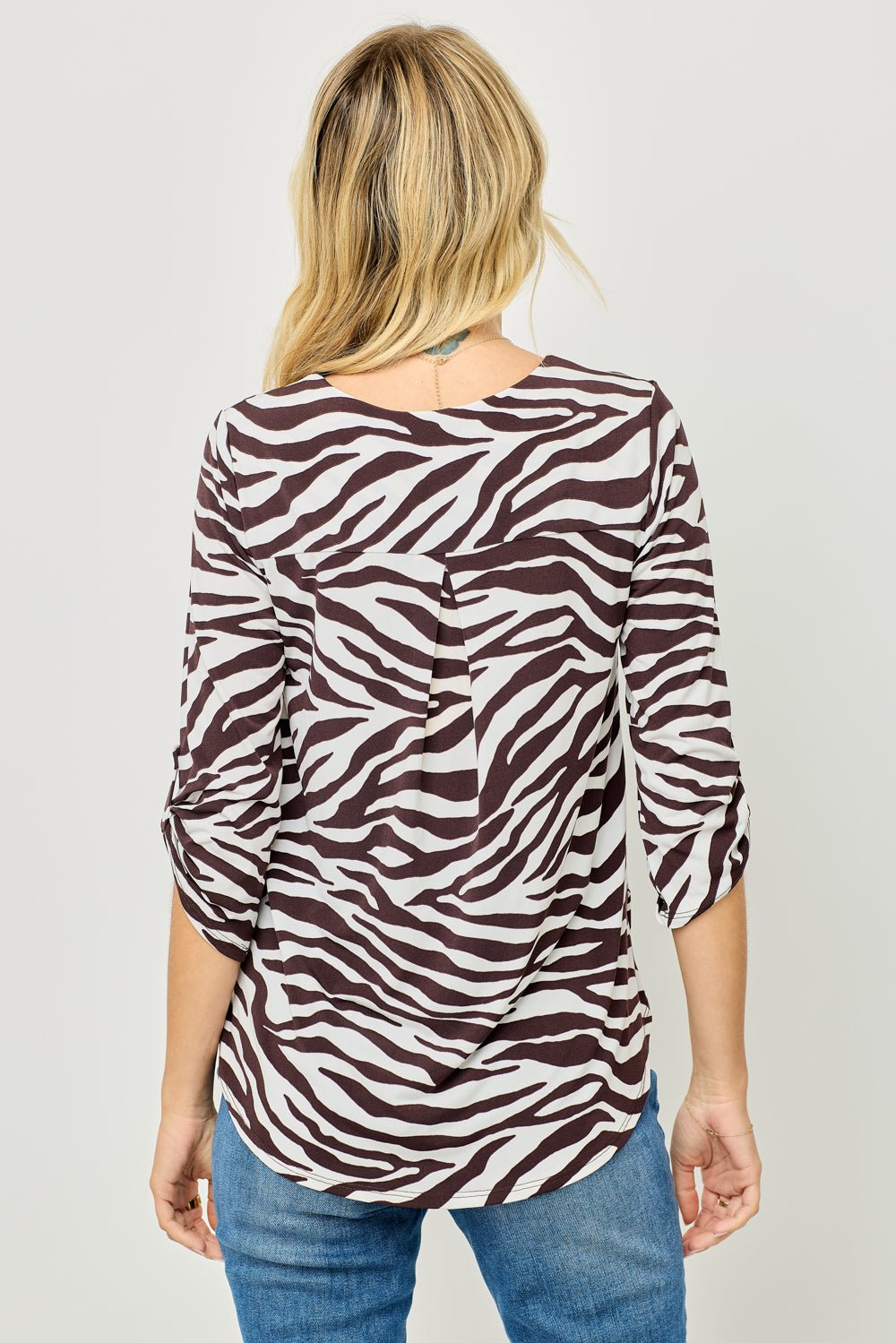 Image of West K Alexa Knit Surplice Roll Tab Blouse White Brown Zebra