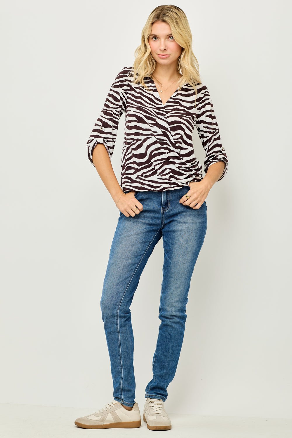 Image of West K Alexa Knit Surplice Roll Tab Blouse White Brown Zebra