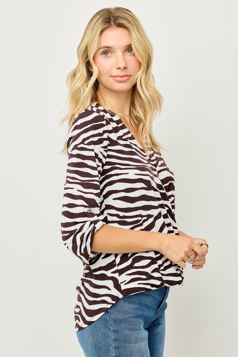 Image of West K Alexa Knit Surplice Roll Tab Blouse White Brown Zebra