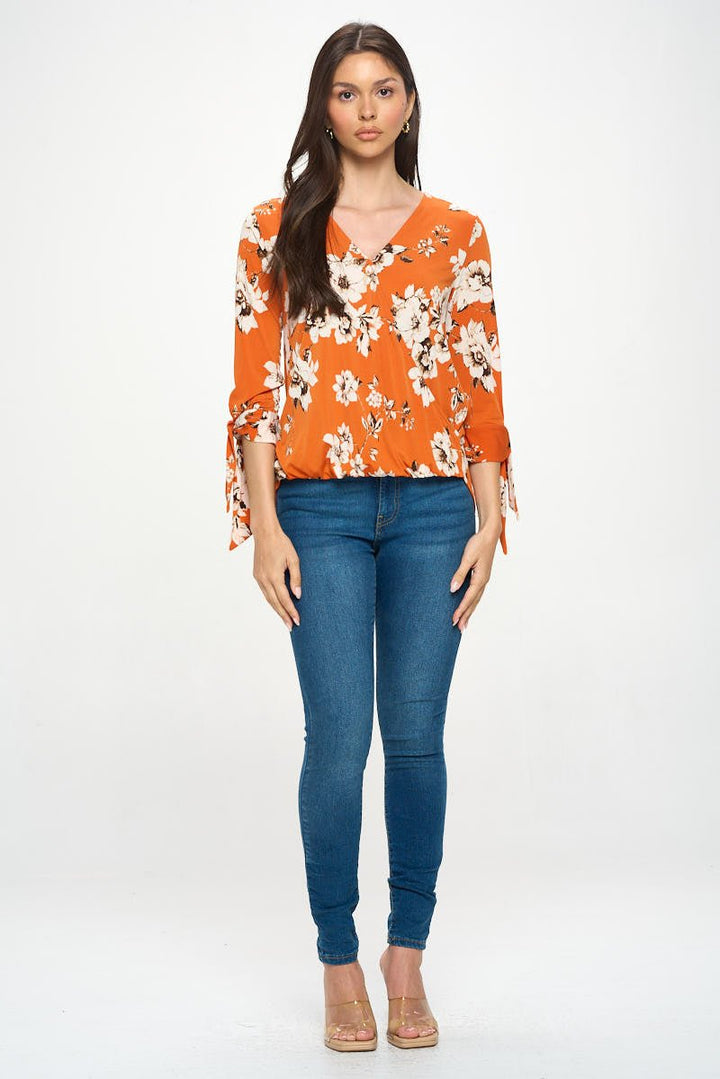 Image of West K Gylda Knit Surplice Top Orange White Floral