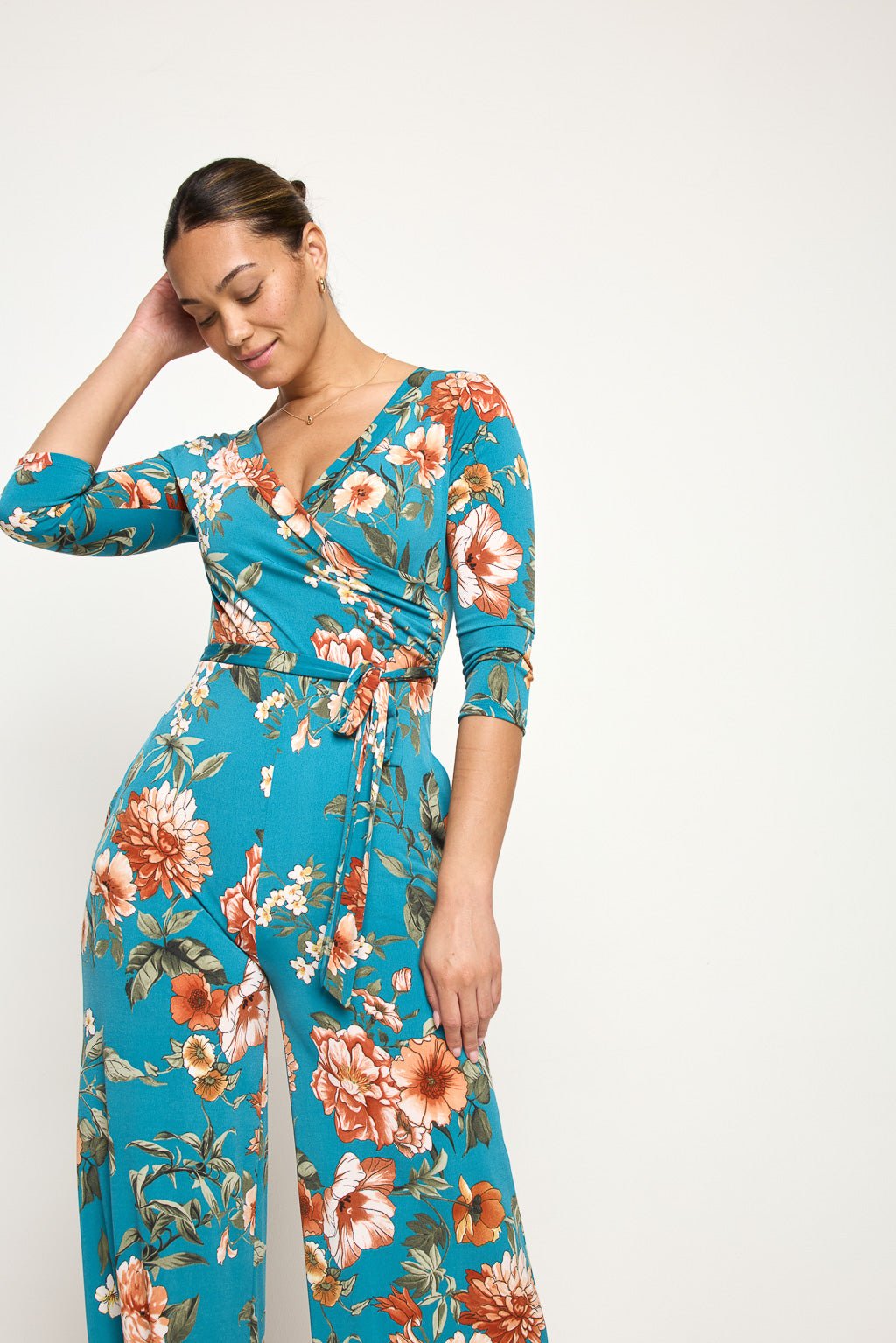 Image of West K Shay Surplice Neck Jumpsuit Turquoise Floral